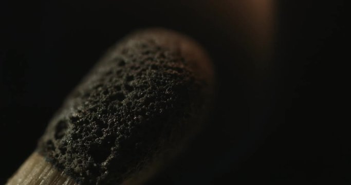 Match lighting and burning. Extreme macro shot on black background