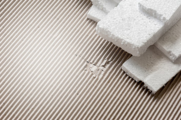 Fototapeta na wymiar White polystyrene foam, material for packaging or craft applications