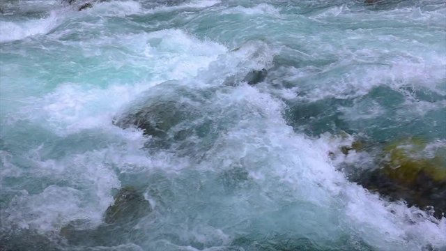 Mountain river water with slow motion closeup