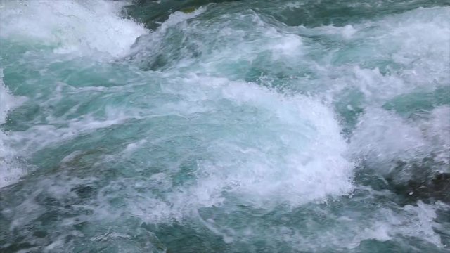 Mountain river water with slow motion closeup