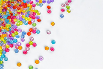 Background of colored beads on a white background