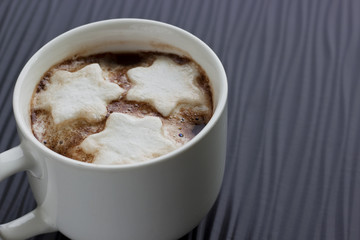 Close-up on a Cup of Hot Chocolate with Snowflake Marshmallows