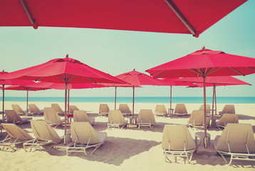 Beach chairs and umbrellas on a sand beach