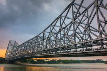 Howrah bridge on the river Hooghly during sunset in Kolkata, India