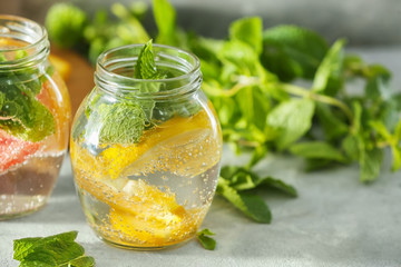 Jar of fruit infused water on table