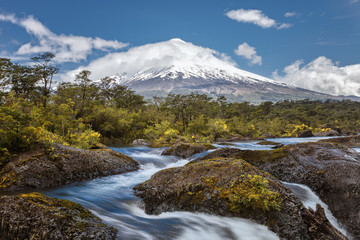 Fototapeta premium Landscape of the Osorno volcano with the Petrohue waterfalls and river in the foreground in the lake district near Puerto Varas and Puerto Montt, Chile.
