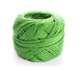 Green yarn ball on white background