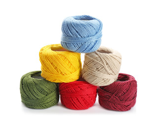 Colorful yarn balls on white background