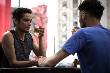 Homosexual Couple Drinking Beer in a Pub in Paulista Avenue, Sao Paulo, Brazil