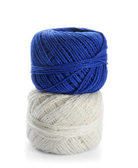 Colorful yarn balls on white background