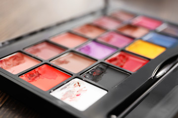 Cosmetic of professional makeup artist on dressing table, closeup