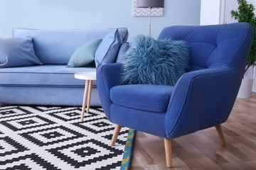 Interior of living room with comfortable armchair