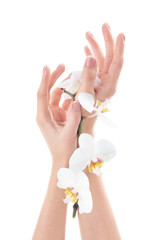 Young woman touching her hand and feeling moisturizing effect of cream on white background
