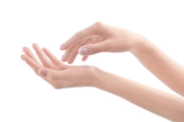 Young woman touching her hand and feeling moisturizing effect of cream on white background
