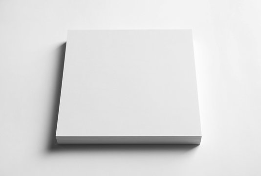 Stacked sheets of paper on white background. Mock up for design