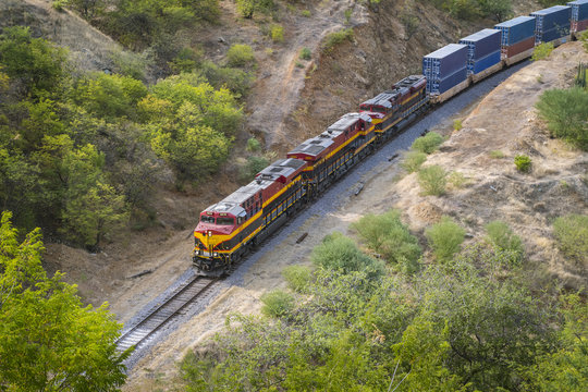 train passing by desert landscape