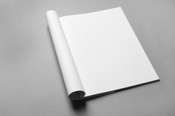 Brochure with blank pages on grey background. Mock up for design