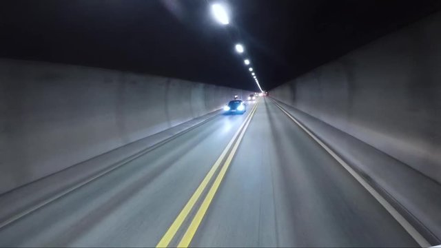 Car rides through the tunnel point-of-view driving