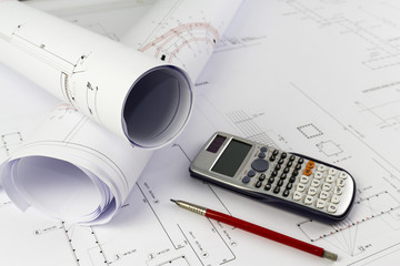 Building design: Office desk with project drawings