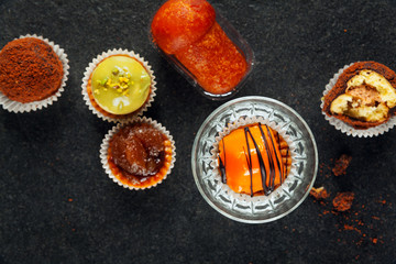 Italian Neapolitan sweets on a black stone background
