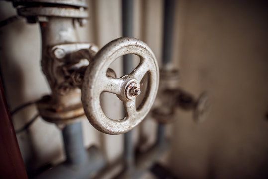 Close Up Focus View Of Industrial Valve Wheel And Stem.