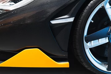 Deurstickers Front car bumper made of carbon fiber © evannovostro