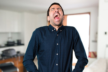 Obraz premium Handsome man shouting inside house