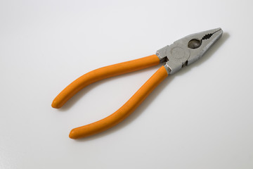 Orange flat-nose plier on a white background