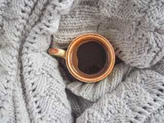 A Cup of coffee and knit a sweater. Comfort on cold days.
