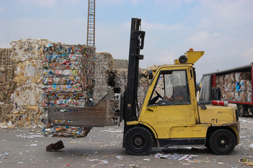 Loading of sorted garbage at the waste processing plant. Waste packaging and paper.
