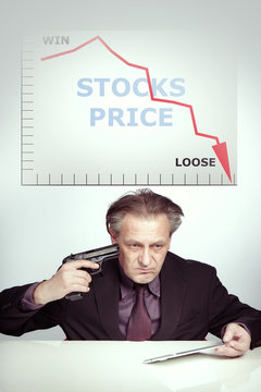 Desperate Man in suit is angry about priceless stocks and planning end his life by handgun