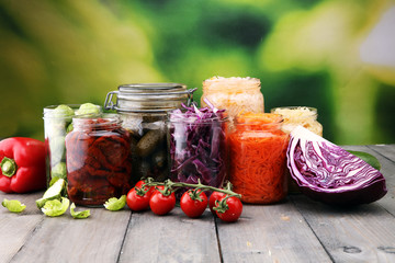 Jars with variety of pickled vegetables. Preserved food