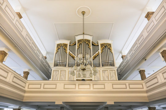 Pipe organ at white church interior