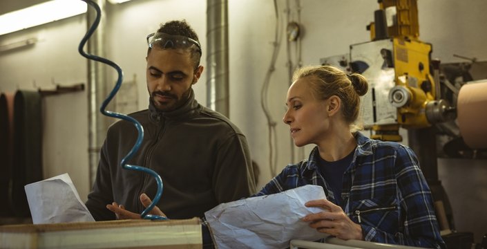 Two workers discussing with each other