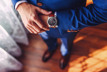 A successful businessman or groom wearing an expensive watch.jpg - obrazy, fototapety, plakaty