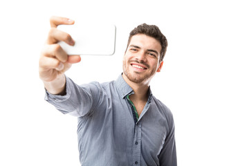 Latin man taking a selfie