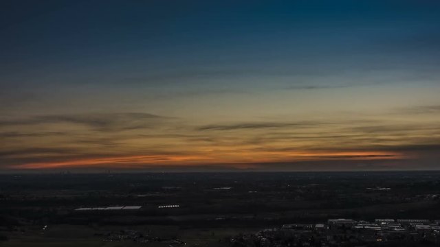 Timelapse of Milan city area and Po Valley, Italy at sunrise. Aerial View