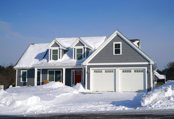 Fototapeta premium Winter house front view after snow storm