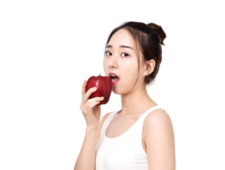 Happy healthy girl. Toothy smile portrait of a beautiful young woman, holding an apple, isolated on white.