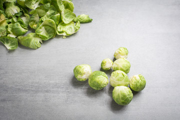 Brussel sprouts and peels on a stone background
