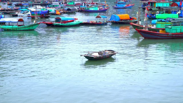 A large number of traditional fishing boats around the station. The village in Vietnam. The island in Vietnam. Boats on pier. Vietnam. popular travel destination.