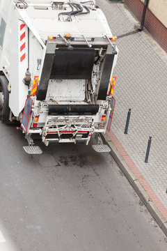 Garbage dustcart truck on city street