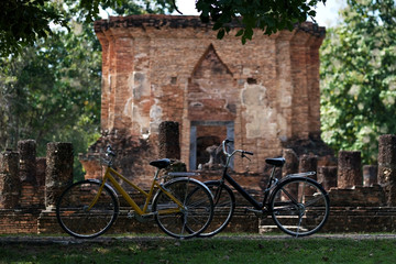 bicycle near the wall of old temple in Sukhothai, Old Town. Concept ob bike tour in asia