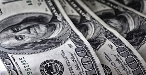 Paper dollar bills are on the table close-up.