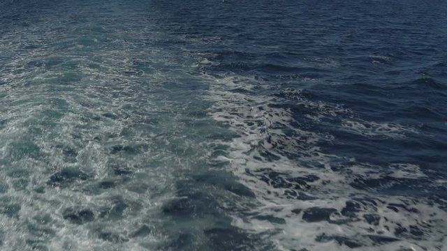 trace tail of speed boat on water surface in the sea.