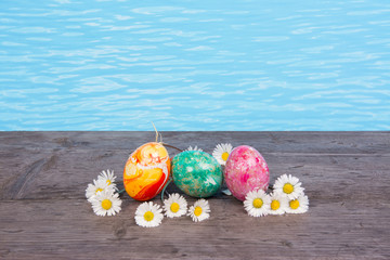 Easter in pool, wellness and relax. Eggs and water background for party and spa