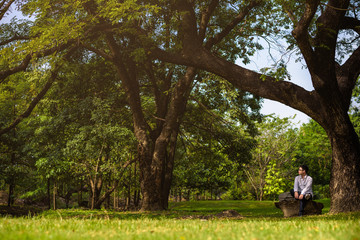 man relaxing in nature park.