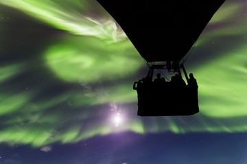 Hot air balloon on a background of the Northern Lights