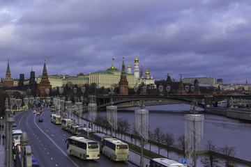 Fototapeta na wymiar View of the Kremlin from the Patriarchal bridge . Parked tour buses in the foreground.