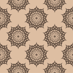 Brown floral ornament on beige background. Seamless pattern